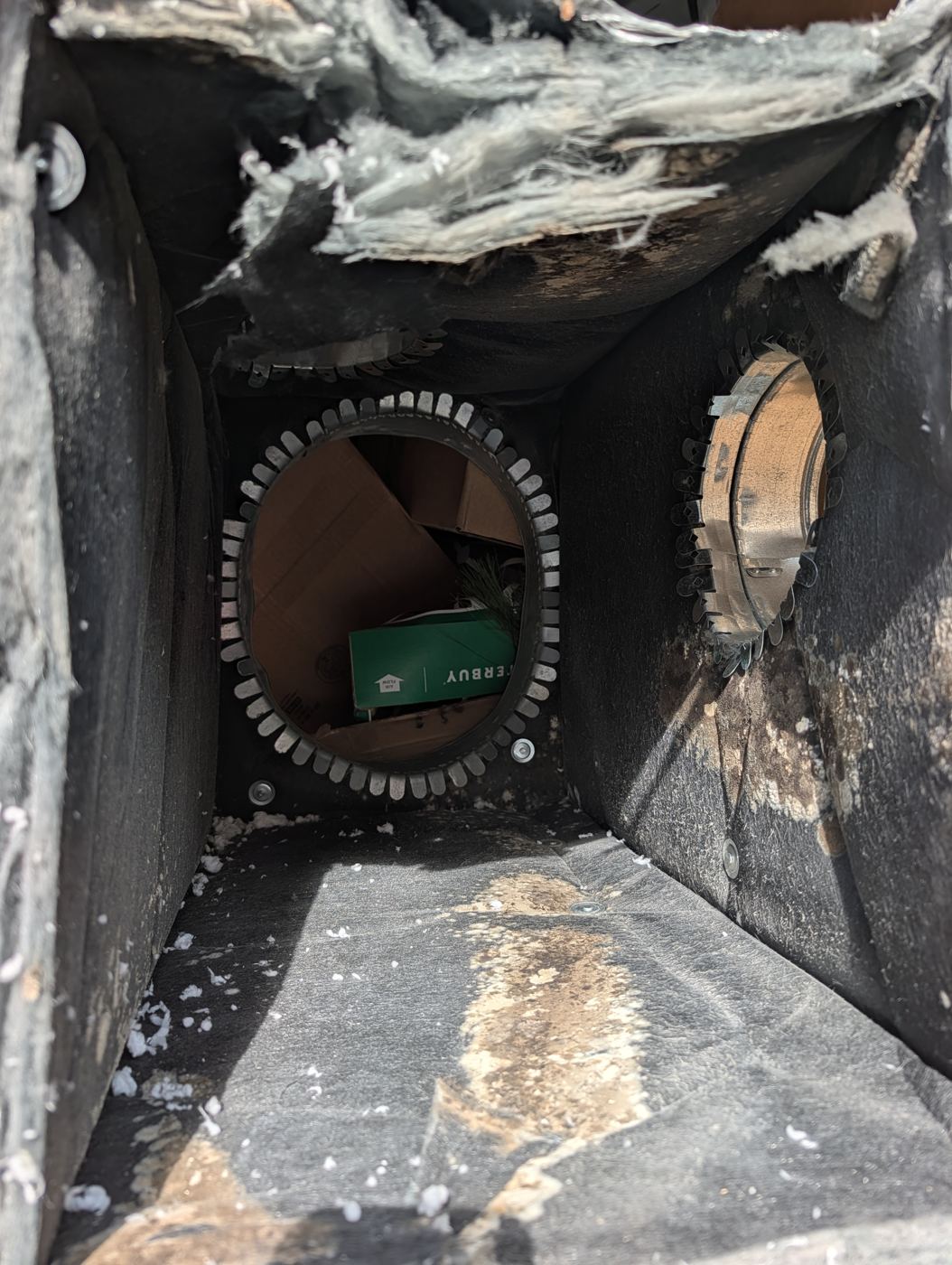 Return plenum with construction debris and years of buildup.