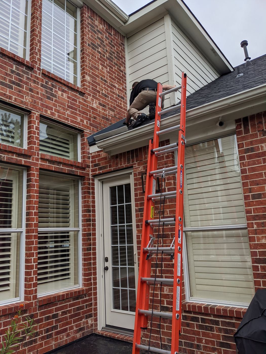 Clearing a rooftop termination cap. We clean the full line, from the dryer to daylight.